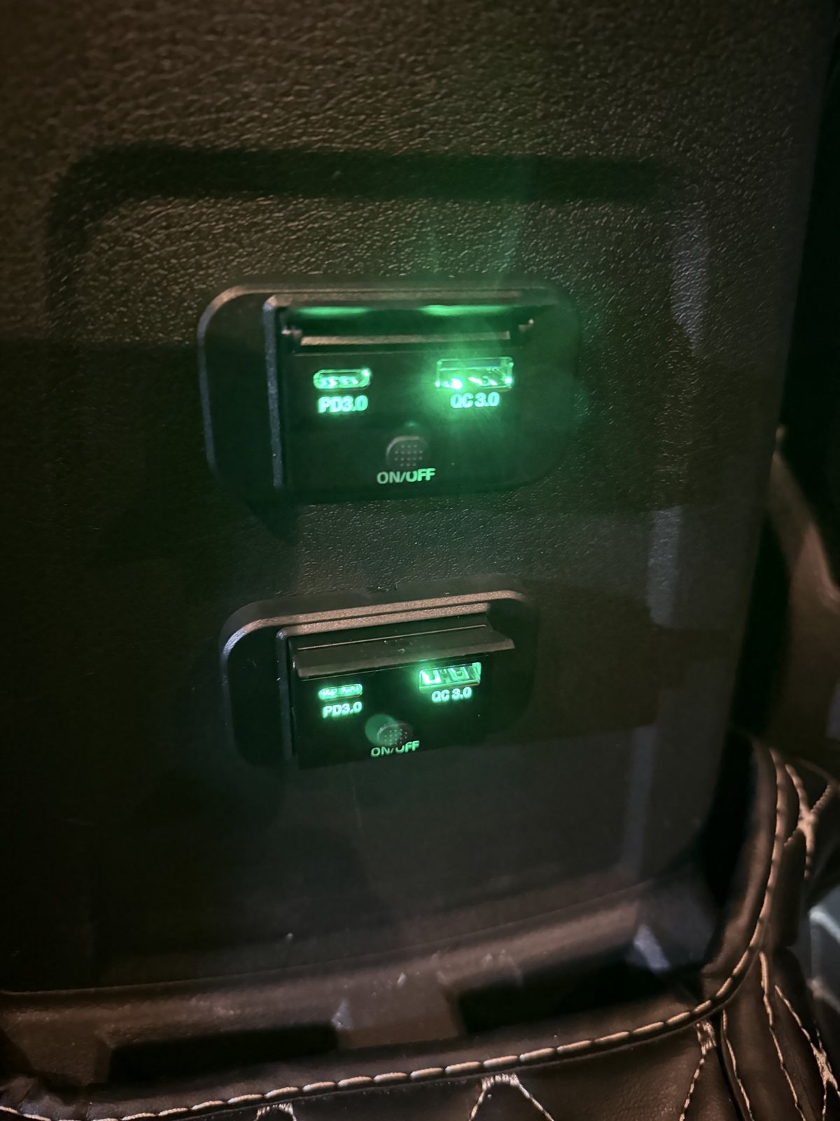 Illuminated dual USB-C fast-charge ports installed in a center console