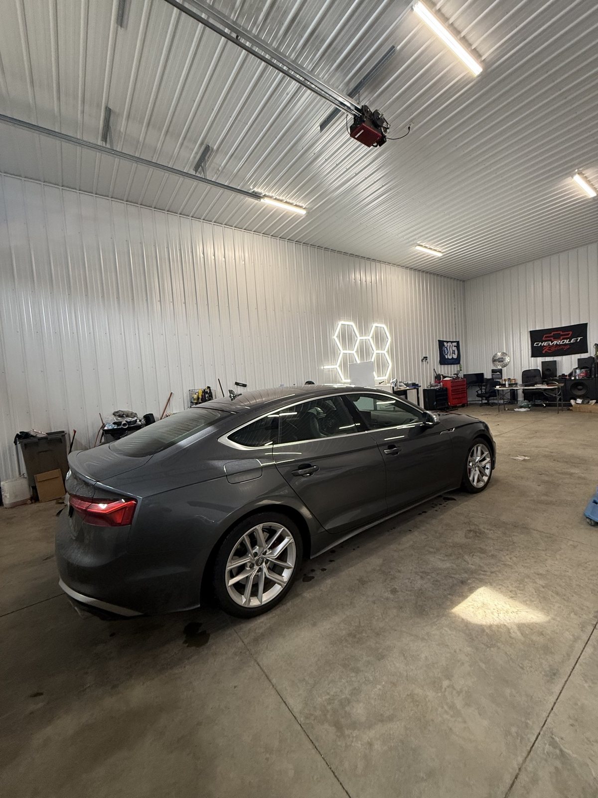 Grey Audi S5 Sportback in the shop before tint, glass still light