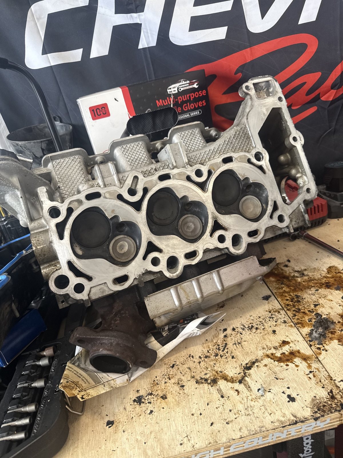 Cylinder head on the bench during inspection and machine prep