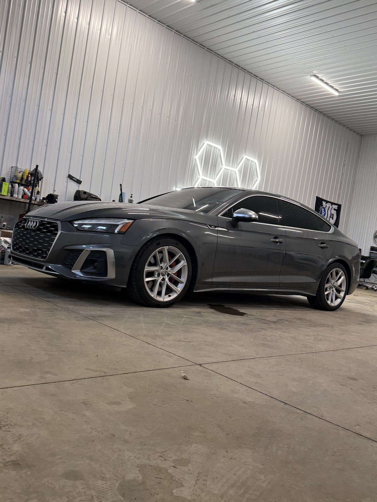 Grey Audi S5 Sportback side profile with tint applied all around