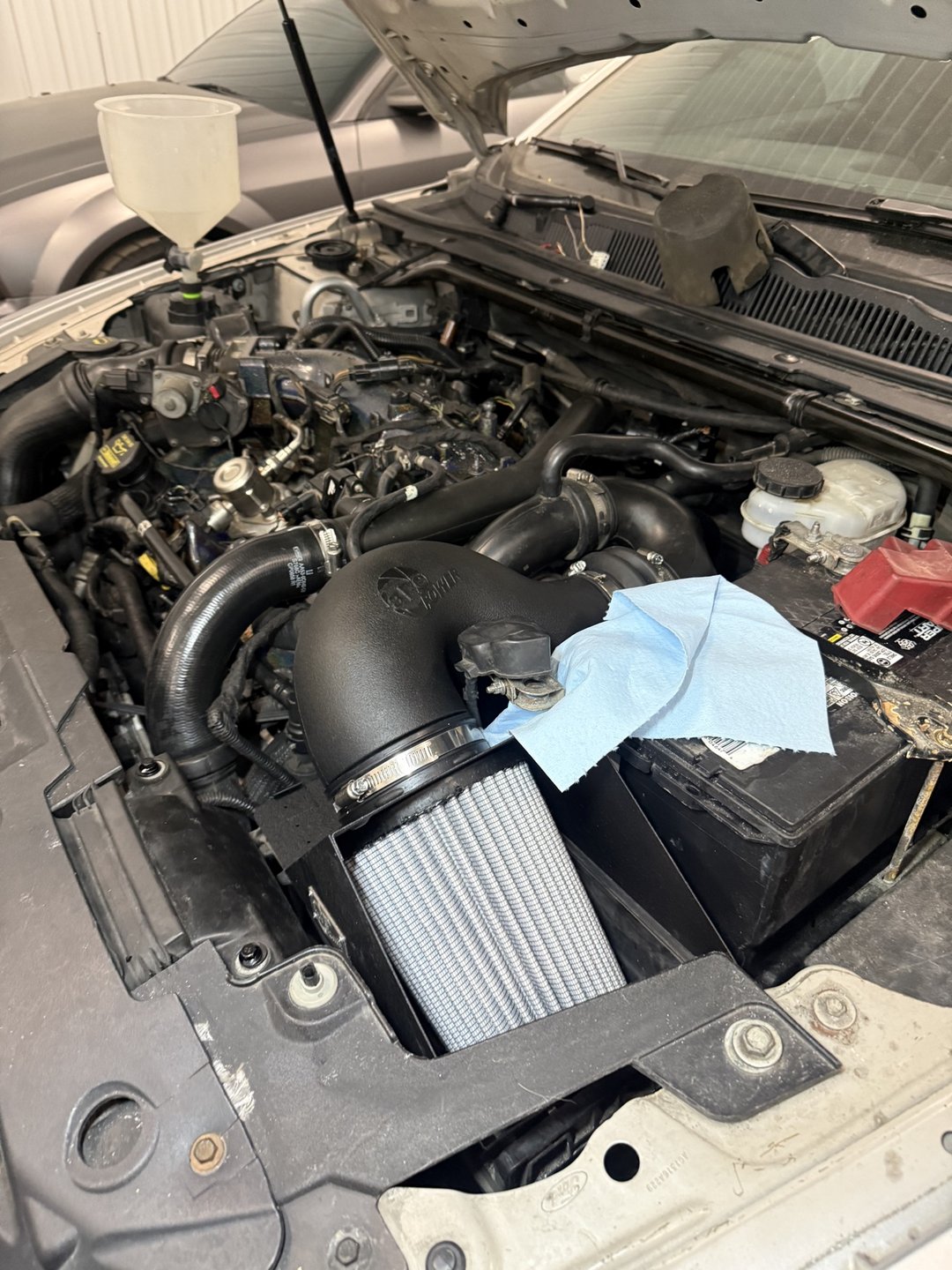 Past shop build — 2010 Taurus SHO cold air intake close-up in the engine bay