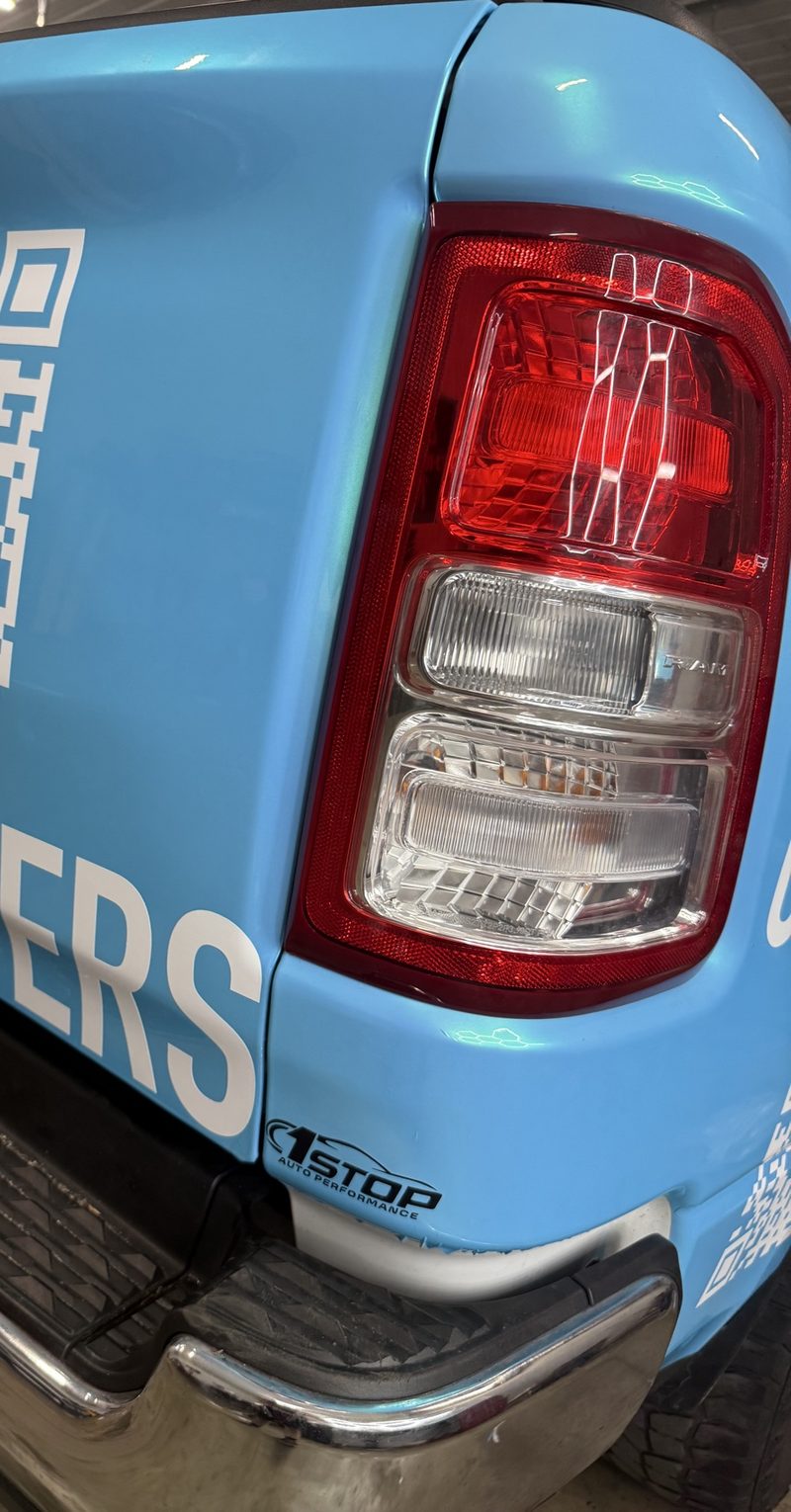 Finished wrap with a small black 1Stop Auto Performance logo decal below the taillight