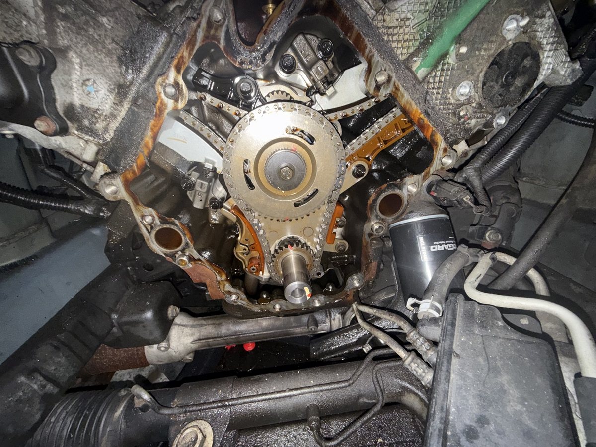 Front of an engine opened up for a timing chain and phaser job