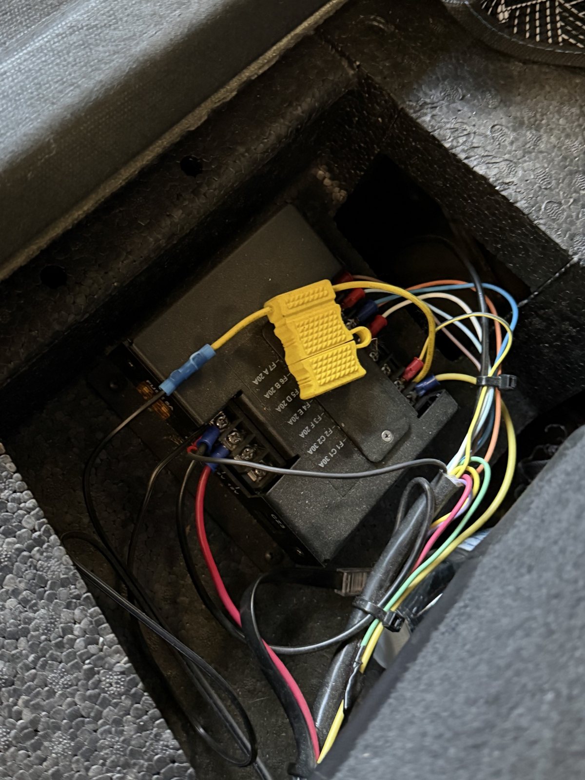 The security vehicle's old control box with loose, messy wiring before the rewire