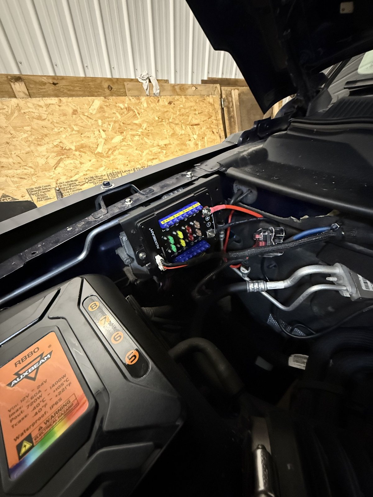 Auxbeam switch system control box mounted clean under the Jeep hood