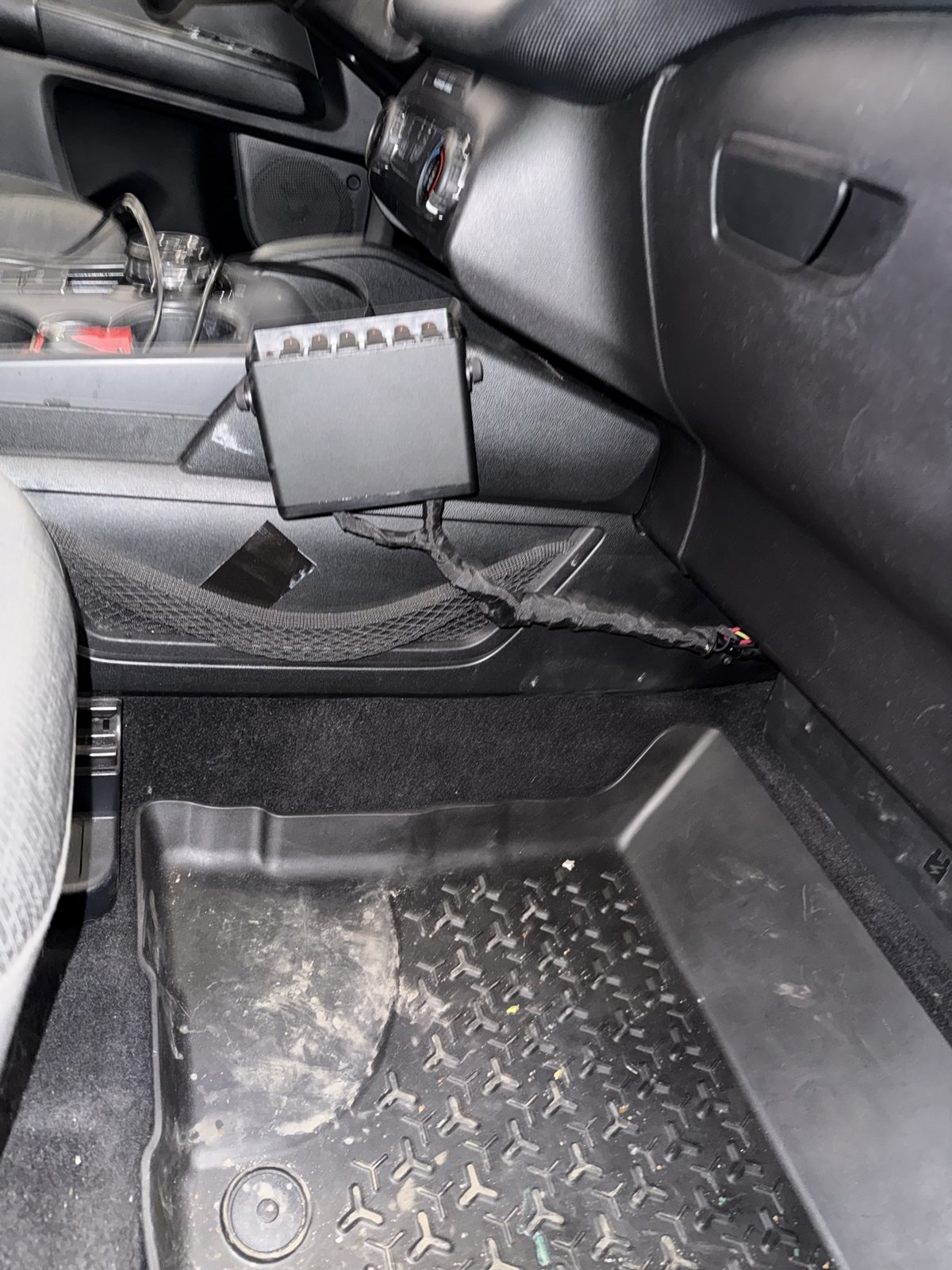 Finished switch panel mounted on the console side with a neatly loomed harness