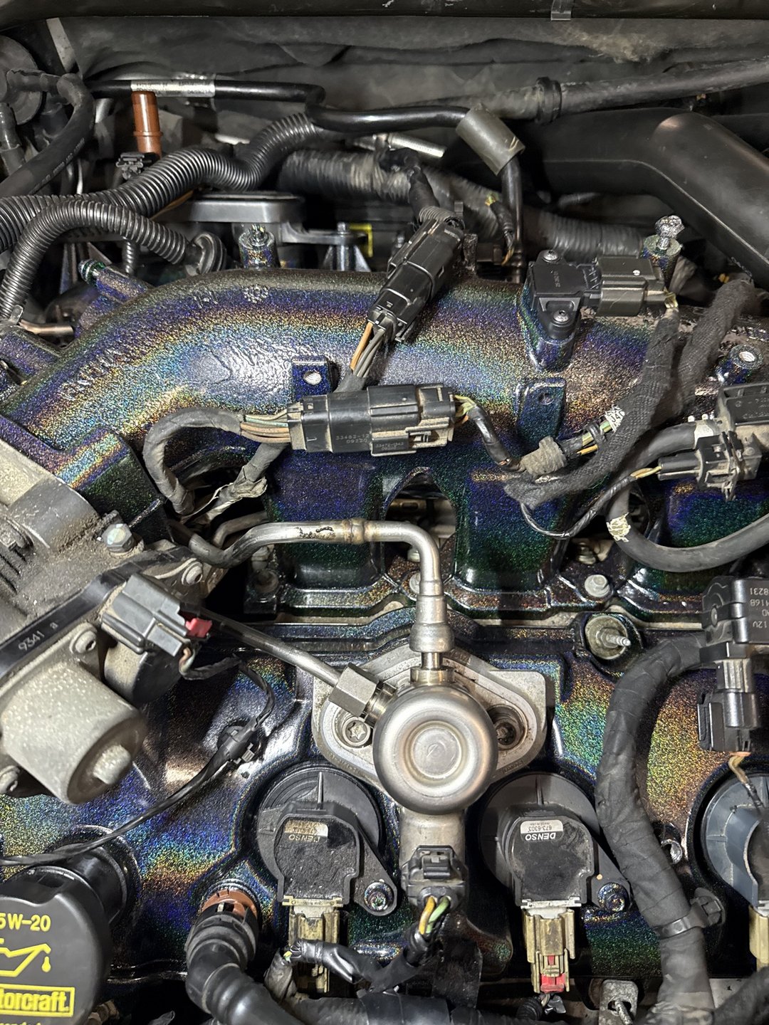 Past shop build — close-up of the 2010 Taurus SHO holographic powder-coated intake manifold by 1Coat